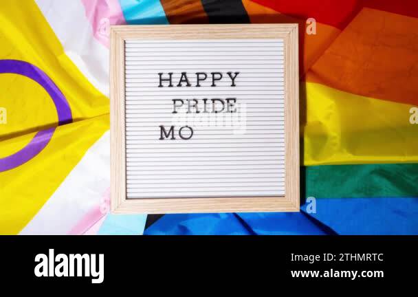 Stop motion HAPPY PRIDE MONTH frame on Rainbow LGBTQIA flag made from ...