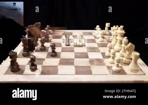 A game of chess being played in stop motion with hands moving the ...