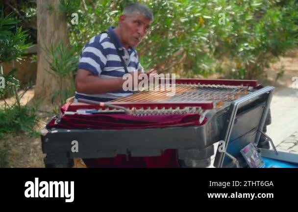 Busker playing musical instrument Stock Videos & Footage - HD and 4K ...