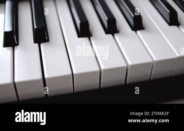 Dolly slider close shot shallow depth of field piano keyboard electric ...