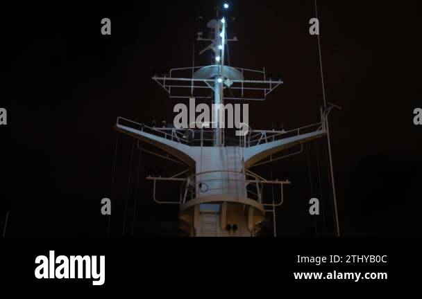 At the highest point of the white cruise ship operates a radar is ...