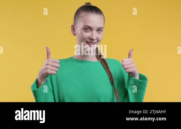 Young woman with hand sign like, thumbs up gesture. Happy student ...