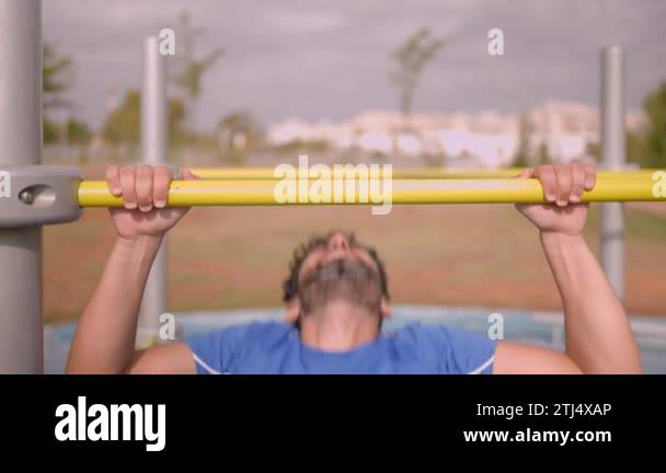 Male pull up workout steps. Caucasian man hanging on a bar to working ...