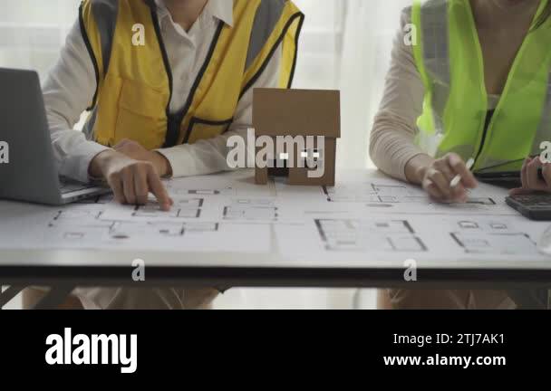 Asian architect engineer, worker, two women in hats and uniforms ...