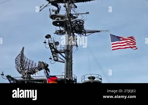 USA flag and antennas on carrier control tower in blue sky Stock Video ...