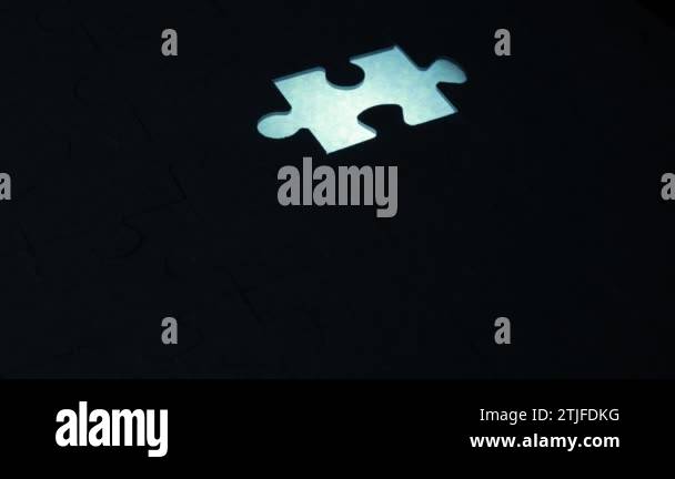 A creative completes the black or white light puzzle putting the last