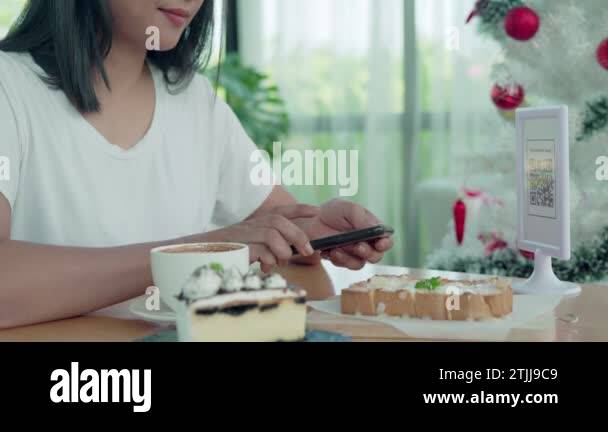 Beautiful woman scan barcodes for order. Women using their mobile ...