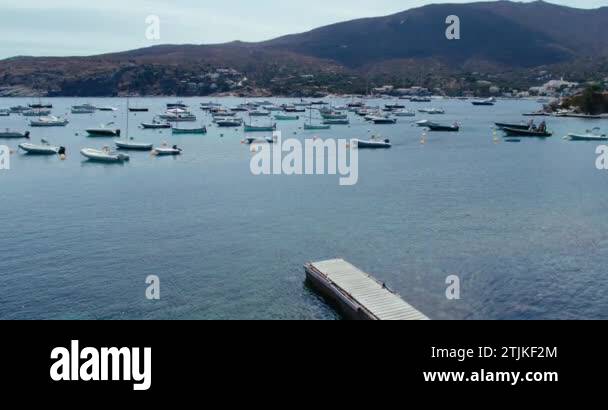 Idyllic picture of a little bay with many parked fishermen boats and an ...
