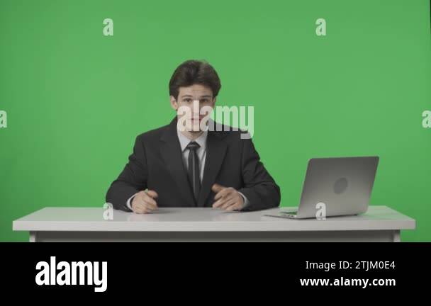 Live News Program: A presenter covering current events. A man browses ...