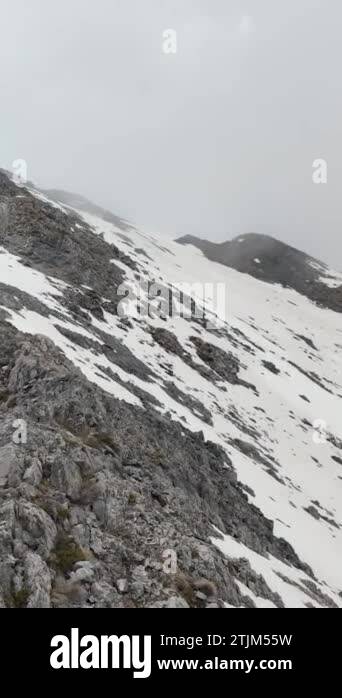 Unveil the splendor of heavenly clouds embracing snowy mountain peaks
