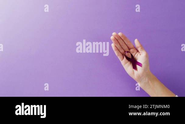 Purple Adhd Ribbon Video of hand holding add or adhd awareness ribbon on purple background ...
