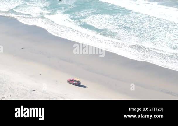 Lifeguard red pickup truck, life guard auto on sand, California ocean ...