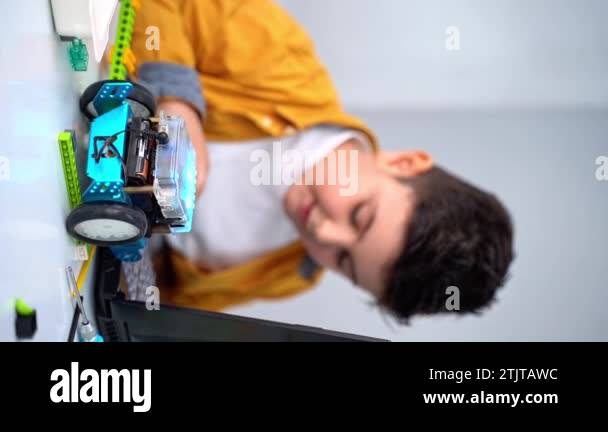 Robotics programming class. Children construct Mbot and code Robot ...