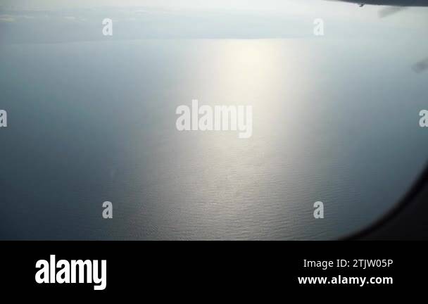 Sky and sea with reflection as seen in window of an aircraft Stock ...