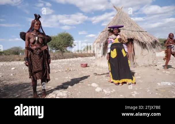 Opuwo, Namibia - July 24, 23: Woman from Himba tribe and Herero tribe