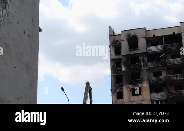 Traces of an artillery shell hitting a multi-storey residential ...