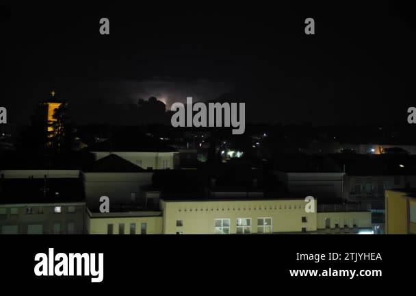 Flashes of lightning over the city at night during a powerful ...
