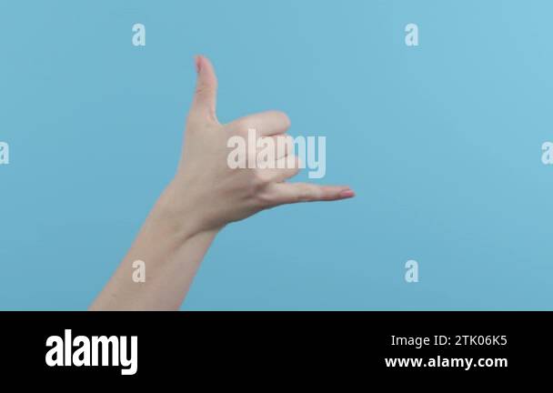 Woman hands showing classic shaka Hawaii surfers greeting, love symbol ...