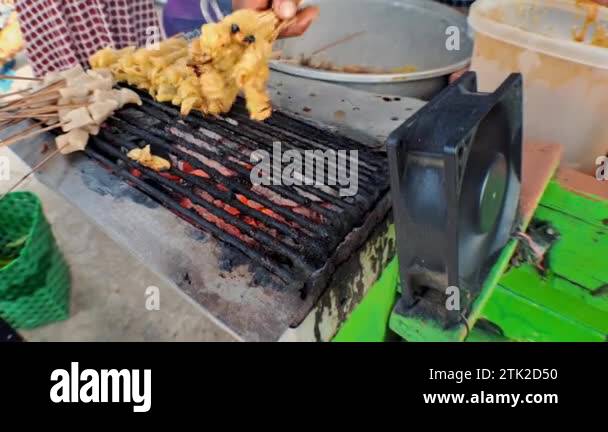 Street Food satay tofu (sate tahu), Tofu grilled with soy sauce, the