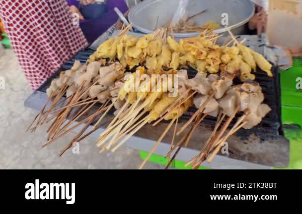 Street Food satay tofu (sate tahu), Tofu grilled with soy sauce, the