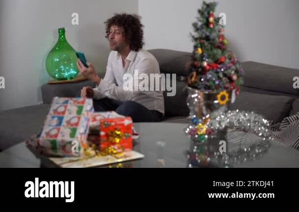 Single man spends Christmas day at home alone with presents and ...