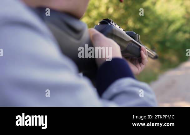 Focus on the target. The correct way to use an air rifle. Body pose ...