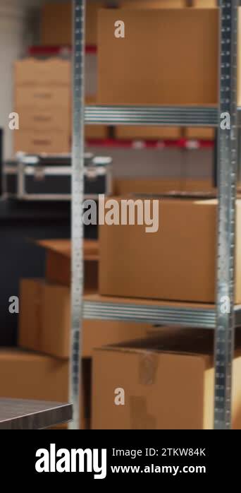 Vertical video: Empty storehouse space filled with multiple goods ...