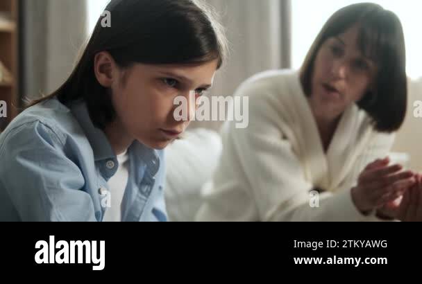Portrait captures a young boy with mother scolding him in the ...