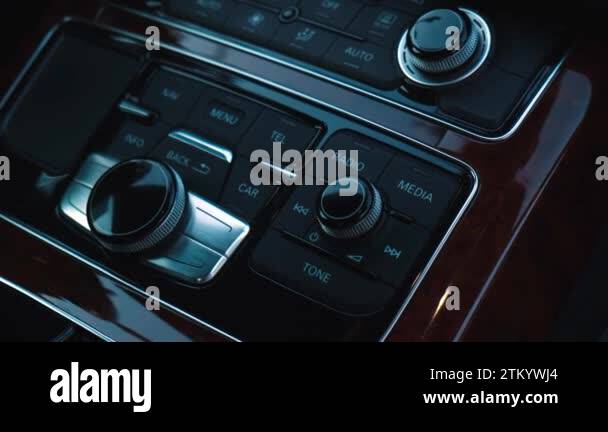Interior of modern luxury car. Details of multimedia menu control ...
