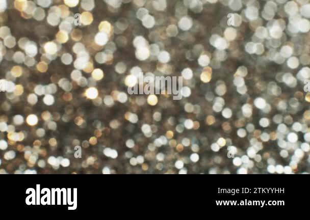 Spangle magic. Defocused lights. Silver background. Light tinsels ...