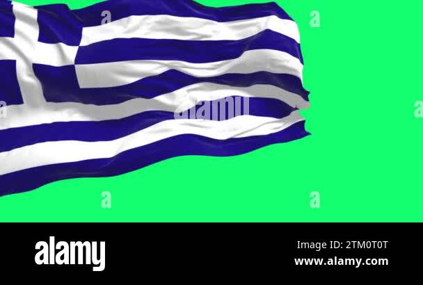 National flag of Greece waving in the wind isolated on a green ...