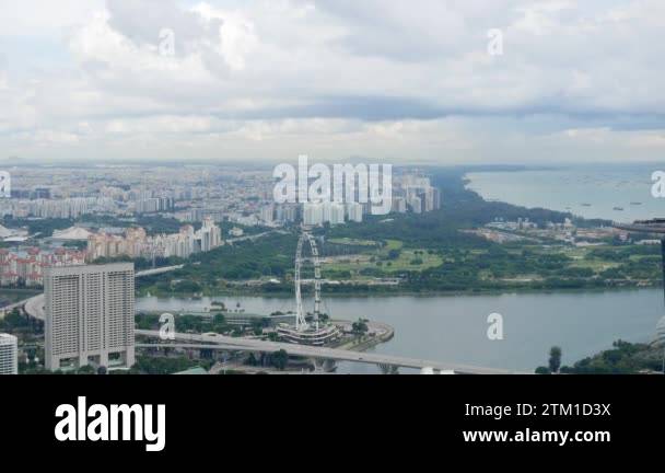 aerial landscape view over marina bay area with giant ferris wheel ...