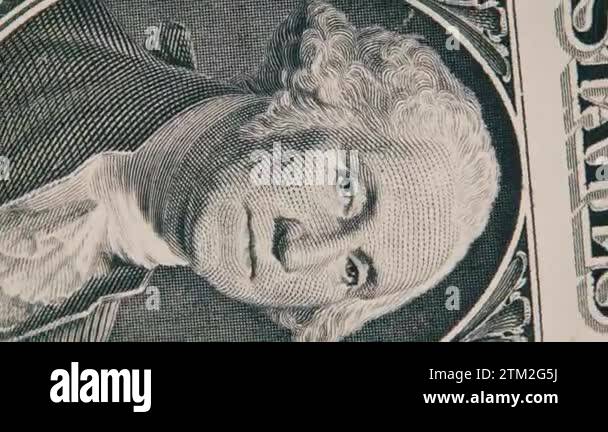 The portrait of George Washington on the one dollar bill rotates close