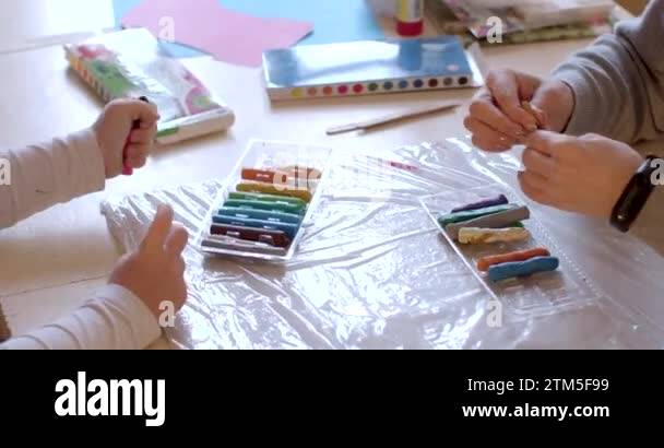 Hands of teacher and child at individual modeling lesson. Effective ...