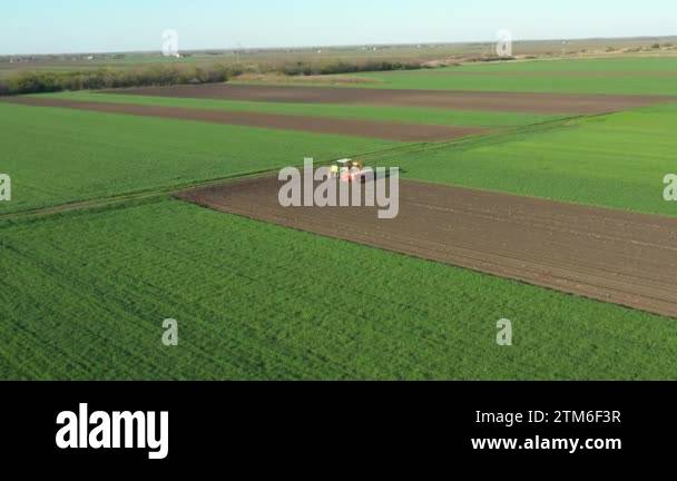 Above rotation view, orbit dolly move, of tractor as pulling mechanical ...
