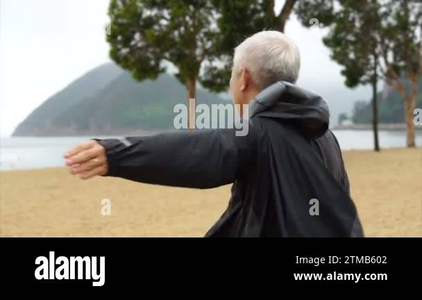 An old man standing alone at the beach Stock Videos & Footage - HD and ...