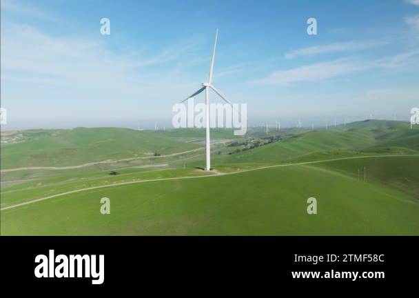 Eco friendly concept. Scenic aerial view of wind turbine on sunny day ...