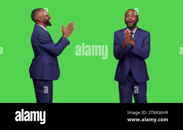 Positive optimistic adult clapping hands and applauding, posing over ...