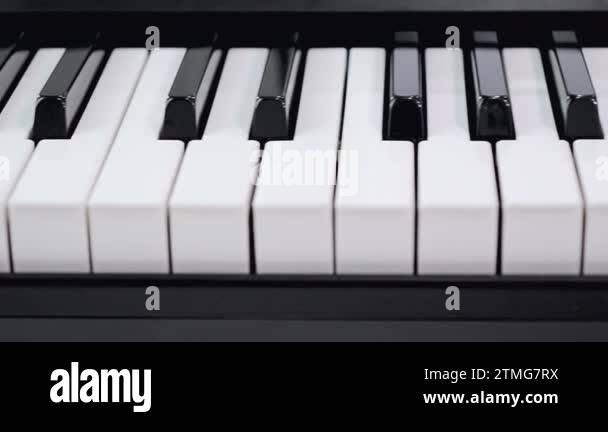 Dolly slider close shot shallow depth of field piano keyboard electric ...