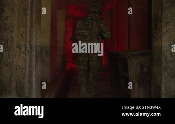 Smart teamwork of soldiers walking forward and attacking enemy during ...