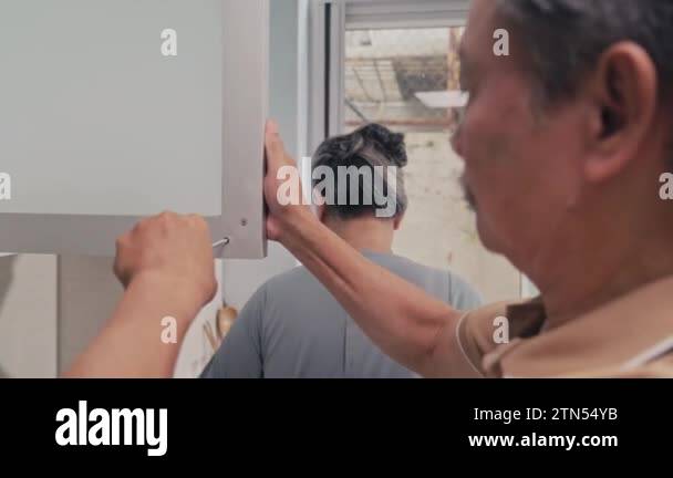 Man fixing door Stock Videos & Footage - HD and 4K Video Clips - Alamy