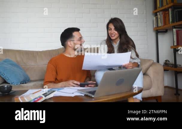 Couple architects working on interior renovation in workplace ...