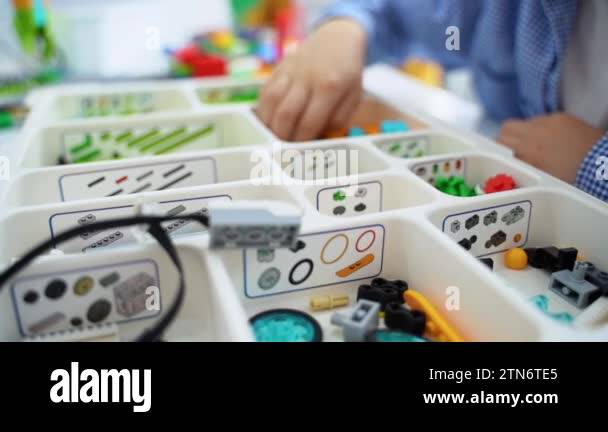 Robotics programming class. Children construct and code Robot. STEM ...