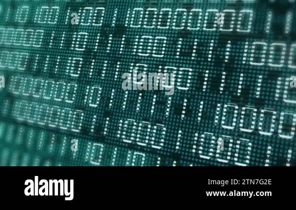 Electronic close up screen with changing binary code. Green computer ...