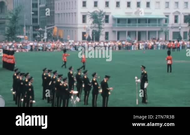 Two soldiers of Royal Canadian Mounted Police marching asynchronously ...
