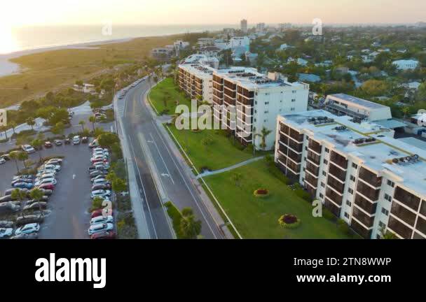 Hotel buildings and parking lot for tourists cars in front of famous ...