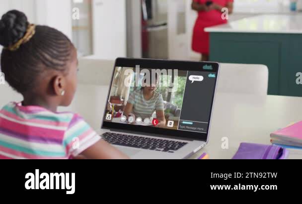 African american girl using laptop for online lesson with asian female ...