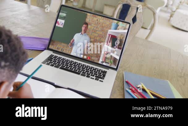 Diverse male student having class during laptop video call with male ...