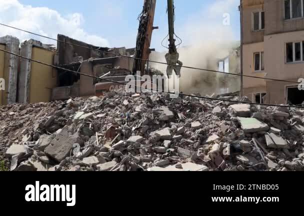 The destruction of a multi-storey building after being hit by an ...