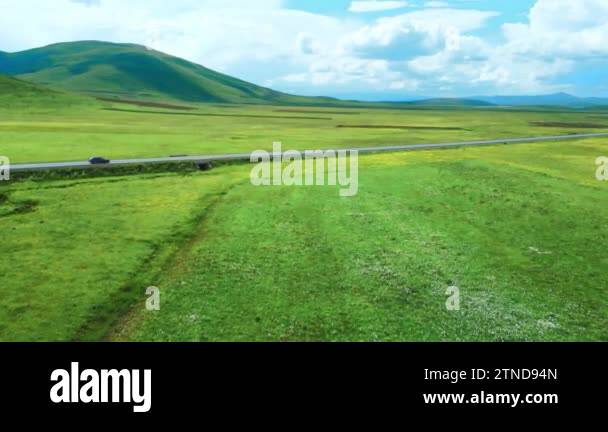 Drone footage shows highway among breathtaking mountains and